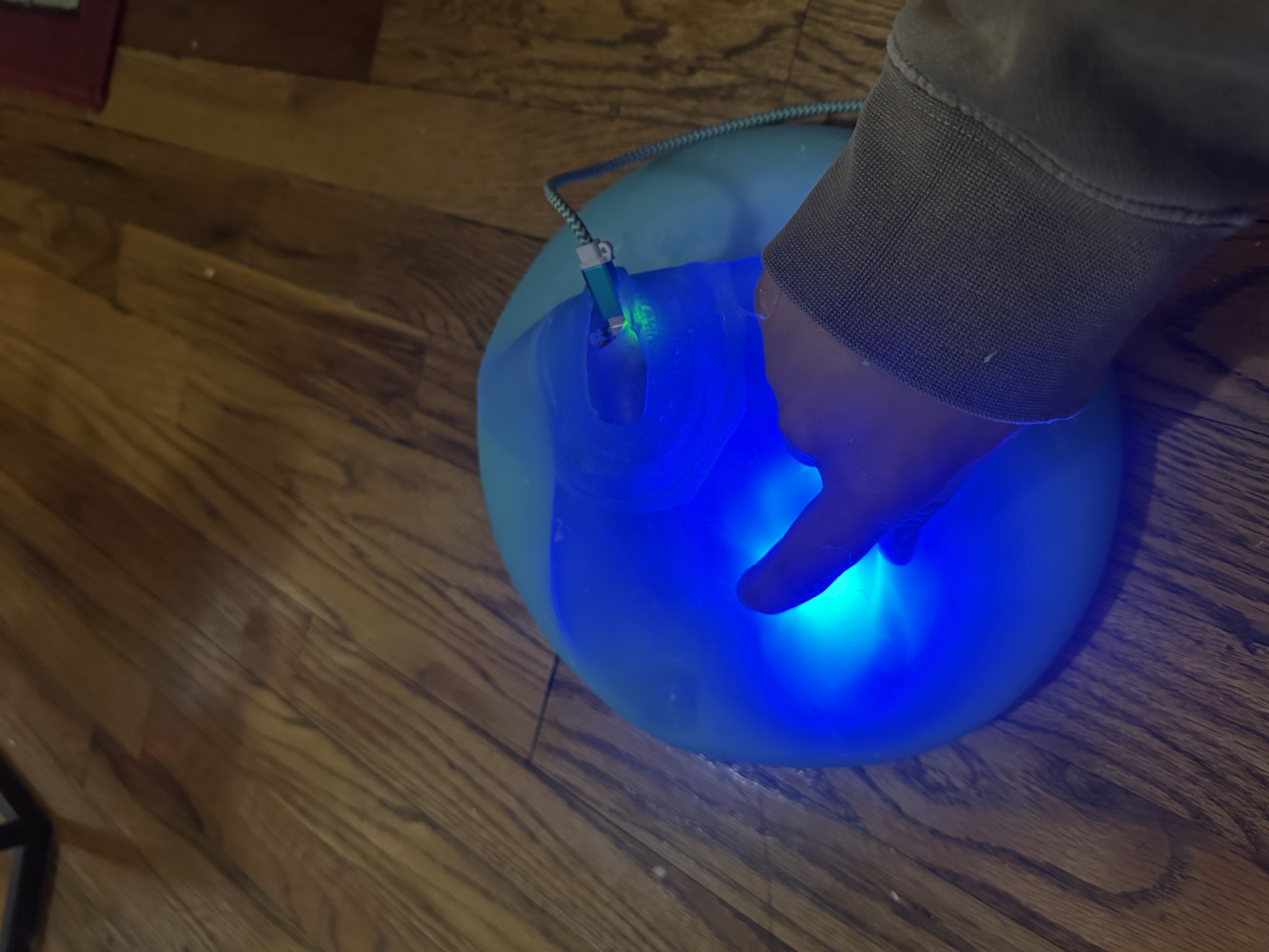 SquishyMusic glowing in hand